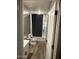 Standard bathroom featuring a shower-tub combo with gray walls and wood-look flooring at 1418 E Jacqueline Pl, Casa Grande, AZ 85122