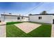 Spacious backyard featuring artificial turf, a brick patio, and low-maintenance landscaping at 1425 E Diamond St, Phoenix, AZ 85006