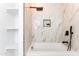 Bright bathroom featuring a soaking tub with luxurious marble tile surround and modern fixtures at 1425 E Diamond St, Phoenix, AZ 85006