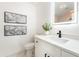 Stylish half bathroom features modern vanity, elegant fixtures, neutral walls, and sleek mirror at 1425 E Diamond St, Phoenix, AZ 85006