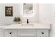 Modern bathroom vanity with a sleek, illuminated mirror and elegant decor for a stylish look at 1425 E Diamond St, Phoenix, AZ 85006