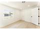 Bright bedroom featuring wood floors, closet, and a large window view at 1425 E Diamond St, Phoenix, AZ 85006