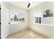 Cozy bedroom featuring wood floors, modern ceiling fan, and a large window view at 1425 E Diamond St, Phoenix, AZ 85006