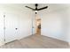 Bright bedroom featuring wood floors, ensuite bathroom, and a large doorway at 1425 E Diamond St, Phoenix, AZ 85006