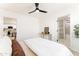 A comfortable bedroom with an open doorway, leading to an elegant bathroom and a modern kitchen at 1425 E Diamond St, Phoenix, AZ 85006