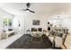 Inviting living room with contemporary decor, neutral tones, natural light, and seamless flow to kitchen at 1425 E Diamond St, Phoenix, AZ 85006