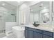 Modern bathroom featuring a soaking tub, walk-in shower, and a sleek vessel sink at 14372 W Cypress St, Goodyear, AZ 85395