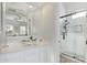 Stylish bathroom features a modern vanity, vessel sink, and a sleek walk-in shower with black trim at 14372 W Cypress St, Goodyear, AZ 85395