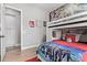 Cozy ' bedroom featuring a bunk bed, vibrant decor, and plenty of storage at 14372 W Cypress St, Goodyear, AZ 85395