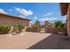 Picturesque courtyard featuring a charming fountain and decorative wrought iron gate at 14372 W Cypress St, Goodyear, AZ 85395