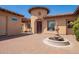 Inviting front entrance featuring a classic fountain and elegant brick pavers at 14372 W Cypress St, Goodyear, AZ 85395