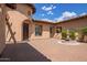 Elegant front entrance complete with a stately fountain and classic brick paving at 14372 W Cypress St, Goodyear, AZ 85395