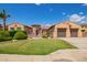 Charming single-story home featuring a well-manicured lawn and an attached two-car garage at 14372 W Cypress St, Goodyear, AZ 85395