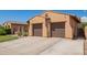 Generous two-car garage and long driveway provide ample parking at this well-maintained home at 14372 W Cypress St, Goodyear, AZ 85395