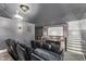 Impressive home theater boasts tiered seating, projector, and sports-themed decor, perfect for entertainment at 14372 W Cypress St, Goodyear, AZ 85395
