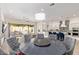 Open-concept kitchen and living area with island, modern appliances, and view to the backyard at 14372 W Cypress St, Goodyear, AZ 85395