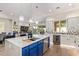 Spacious kitchen with island, modern appliances, and seamless indoor-outdoor living at 14372 W Cypress St, Goodyear, AZ 85395
