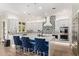 Stylish kitchen with white cabinetry, a patterned backsplash, and stainless steel appliances at 14372 W Cypress St, Goodyear, AZ 85395