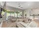Open-concept living room with comfortable seating and access to the backyard patio at 14372 W Cypress St, Goodyear, AZ 85395