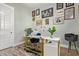 Functional home office featuring a modern desk, gallery wall, and ample storage for a productive workspace at 14372 W Cypress St, Goodyear, AZ 85395