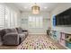Cozy playroom with colorful decor, comfortable seating, and ample storage space at 14372 W Cypress St, Goodyear, AZ 85395
