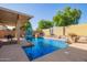 Stunning pool area complete with patio seating, gazebo, and water feature at 14372 W Cypress St, Goodyear, AZ 85395