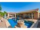 Luxurious backyard showcasing a sparkling pool, patio, gazebo, and mature landscaping at 14372 W Cypress St, Goodyear, AZ 85395