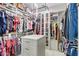Spacious walk-in closet featuring ample storage space, adjustable shelving, and hanging racks at 14372 W Cypress St, Goodyear, AZ 85395