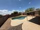 Backyard view of a pool area featuring desert landscaping that creates a private outdoor retreat at 14602 S 47Th St, Phoenix, AZ 85044