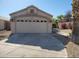 Inviting home featuring a spacious two-car garage and desert landscaping at 14602 S 47Th St, Phoenix, AZ 85044