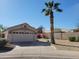 Charming single-story home with a well-manicured yard and a beautiful palm tree at 14602 S 47Th St, Phoenix, AZ 85044