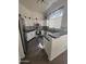 Bright kitchen with white cabinetry, stainless steel appliances, and granite countertops at 14602 S 47Th St, Phoenix, AZ 85044