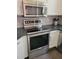 Stainless steel KitchenAid stove and microwave complement the sleek design at 14602 S 47Th St, Phoenix, AZ 85044