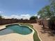 Backyard pool provides a cool escape with a desert landscape and is ready for relaxation and recreation at 14602 S 47Th St, Phoenix, AZ 85044