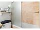 Bright bathroom with tiled shower and decorative accents on shelves at 14826 N 92Nd Pl, Scottsdale, AZ 85260