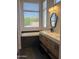 Modern bathroom features double vanity, large soaking tub, and large window at 14826 N 92Nd Pl, Scottsdale, AZ 85260