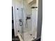The bathroom has a glass shower, floor to ceiling tiles, and black fixtures at 14826 N 92Nd Pl, Scottsdale, AZ 85260