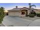 Charming single-story home with well-maintained landscaping, a spacious driveway, and an attached garage at 14826 N 92Nd Pl, Scottsdale, AZ 85260