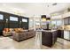 A stylish open-concept living space with a modern kitchen and cozy seating area at 14826 N 92Nd Pl, Scottsdale, AZ 85260