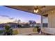 Inviting covered patio with comfortable seating and views of the beautifully landscaped backyard and pool area at 14826 N 92Nd Pl, Scottsdale, AZ 85260
