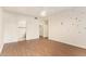 Spacious bedroom offering wood-look floors, a ceiling fan, and multiple doorways creating an open feel at 151 E Broadway Rd # 103, Tempe, AZ 85282