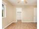 Inviting bedroom with wood-look floors, neutral walls, ceiling fan, and a bright window providing natural light at 151 E Broadway Rd # 103, Tempe, AZ 85282