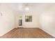 Bright bedroom featuring wood-look floors, large windows, and an airy feel at 151 E Broadway Rd # 103, Tempe, AZ 85282