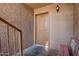 A close up of the front entrance featuring door 103 and a small bench at 151 E Broadway Rd # 103, Tempe, AZ 85282