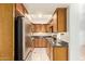 Well-equipped kitchen with stainless steel appliances, granite counters and tile flooring at 151 E Broadway Rd # 103, Tempe, AZ 85282