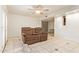 Inviting living room with a ceiling fan, tile flooring, neutral walls, and a comfortable seating area at 151 E Broadway Rd # 103, Tempe, AZ 85282