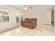 Bright living room with tile flooring, a ceiling fan, neutral walls and patio access at 151 E Broadway Rd # 103, Tempe, AZ 85282