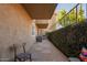 Serene patio view with chairs and privacy wall offering a secluded outdoor space at 151 E Broadway Rd # 103, Tempe, AZ 85282
