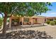 Beautiful covered patio with furniture overlooking a well-maintained gravel backyard at 16412 W Peppertree Ct, Surprise, AZ 85387