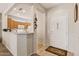 Bright foyer with a view of the kitchen, showcasing an open layout and modern design at 16412 W Peppertree Ct, Surprise, AZ 85387